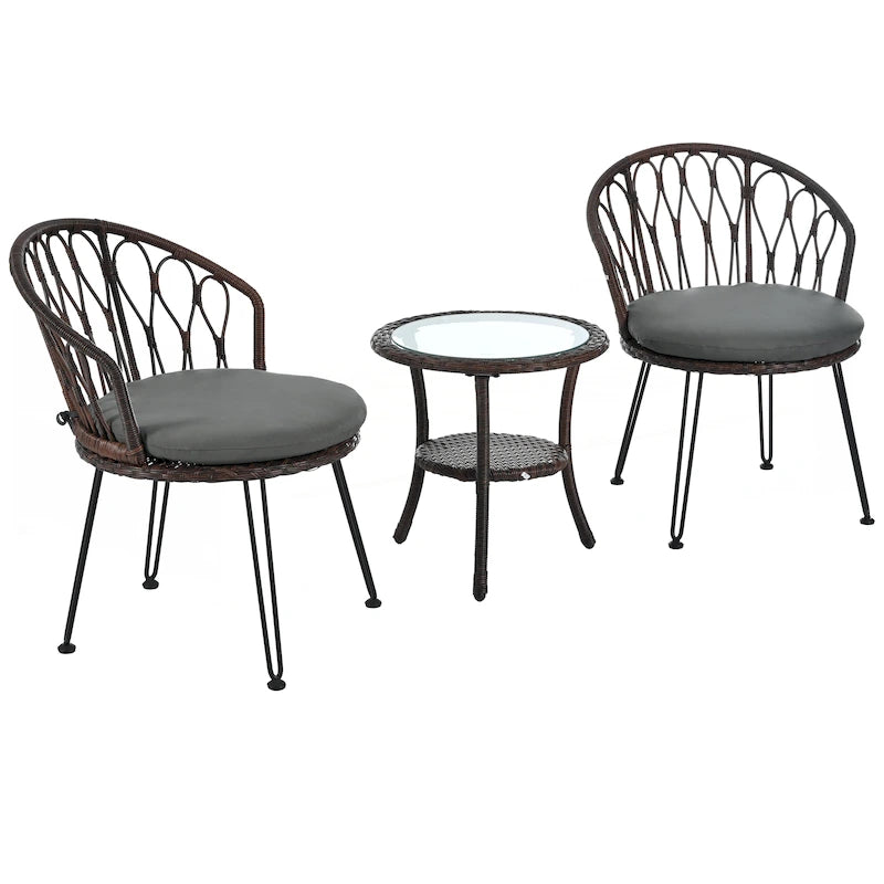 Deux chaises individuelles en rotin avec une table ronde en verre