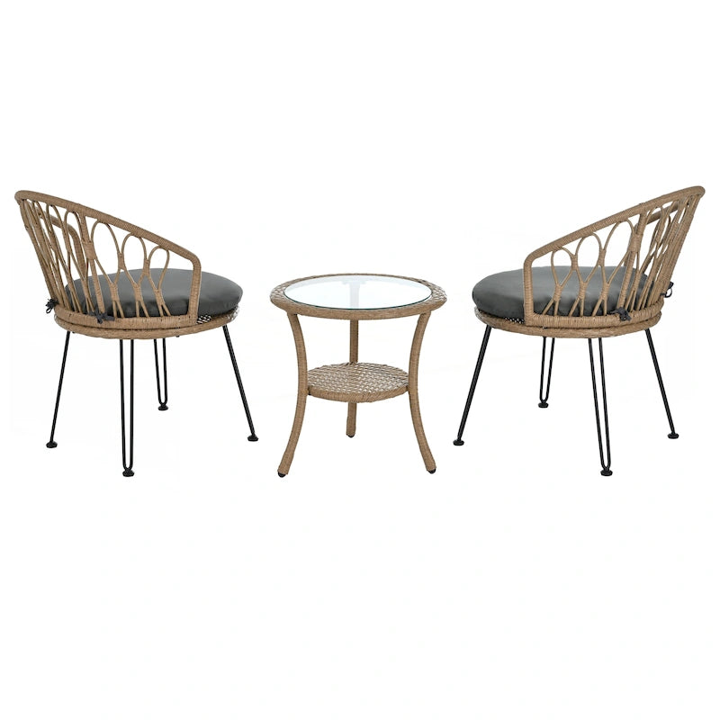 Deux chaises individuelles en rotin avec une table ronde en verre