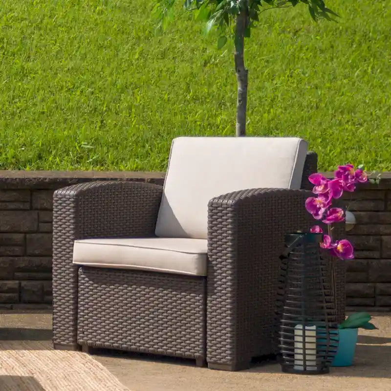 Fauteuil en imitation rotin avec coussin résistant aux intempéries