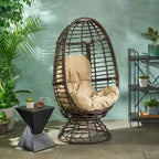 Fauteuil en osier Oaks Aura au design abstrait en maille, fauteuil pivotant en rotin tressé artisanal en forme d'œuf, fauteuil en forme de panier avec coussin