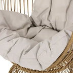 Fauteuil en osier Oaks Aura au design abstrait en maille, fauteuil pivotant en rotin tressé artisanal en forme d'œuf, fauteuil en forme de panier avec coussin